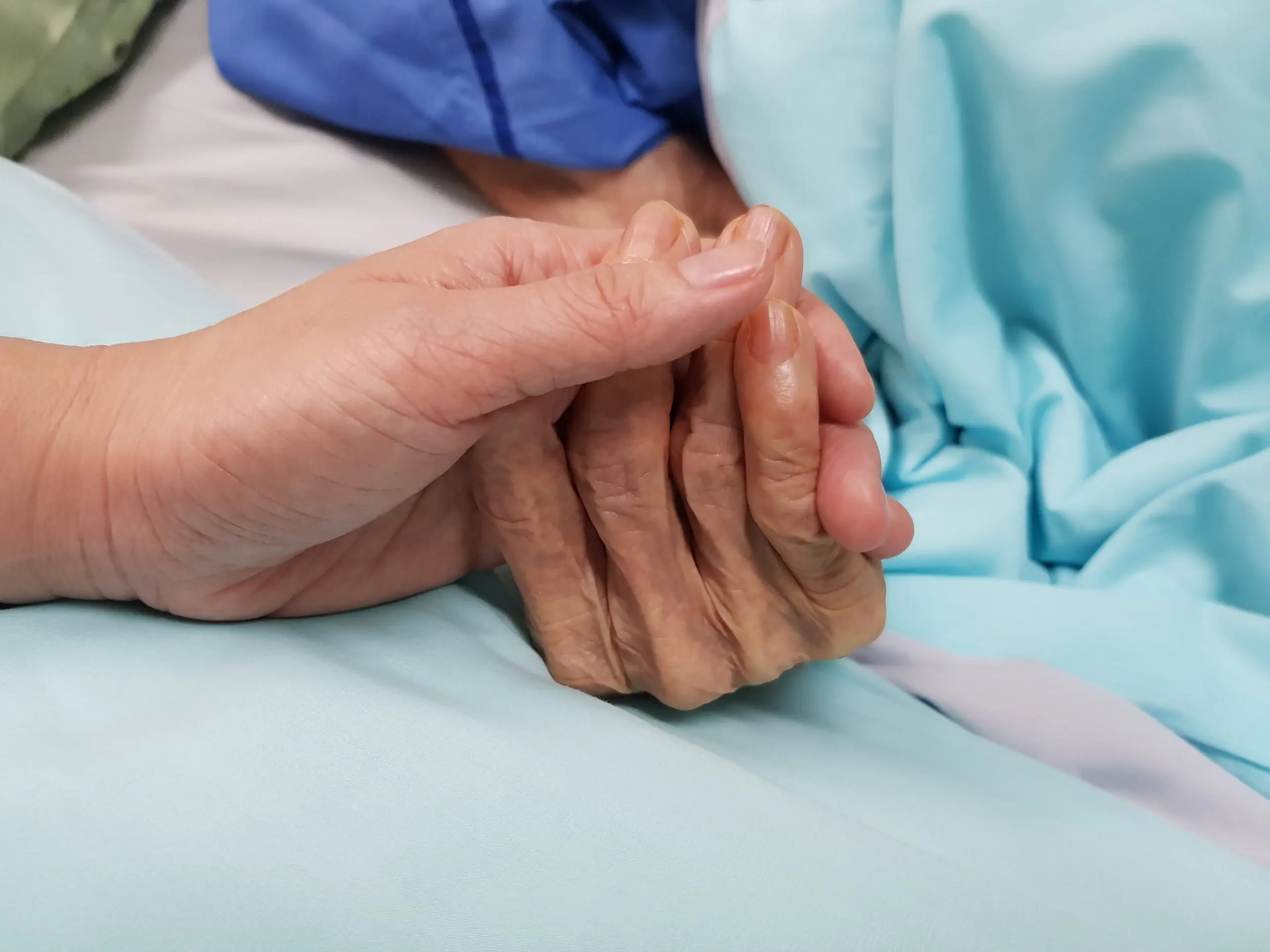 A person holding their hands in the hospital