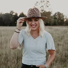 Chloe Bechdolt A woman in a field wearing a hat