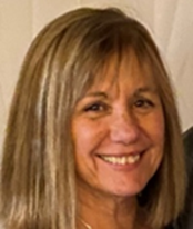 Susan Silvati A woman with long hair smiles for the camera.